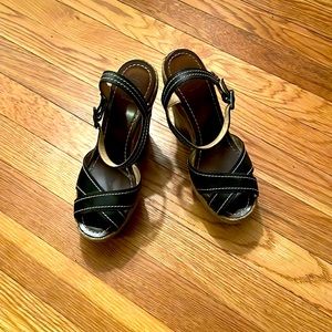 Size 7 Christian Louboutin black espadrille with red bottom sole protectors.